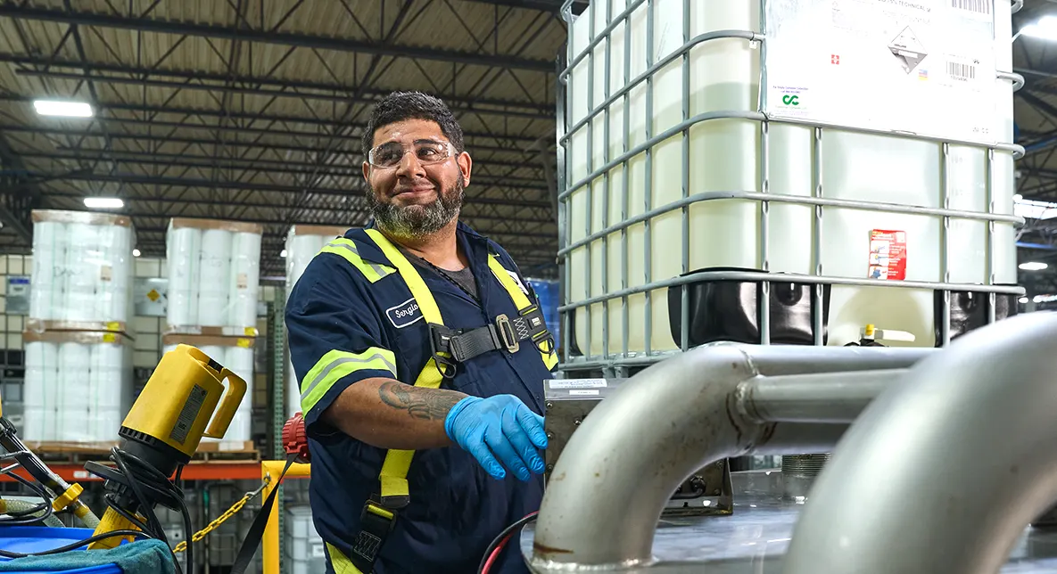 Americo worker filling drum